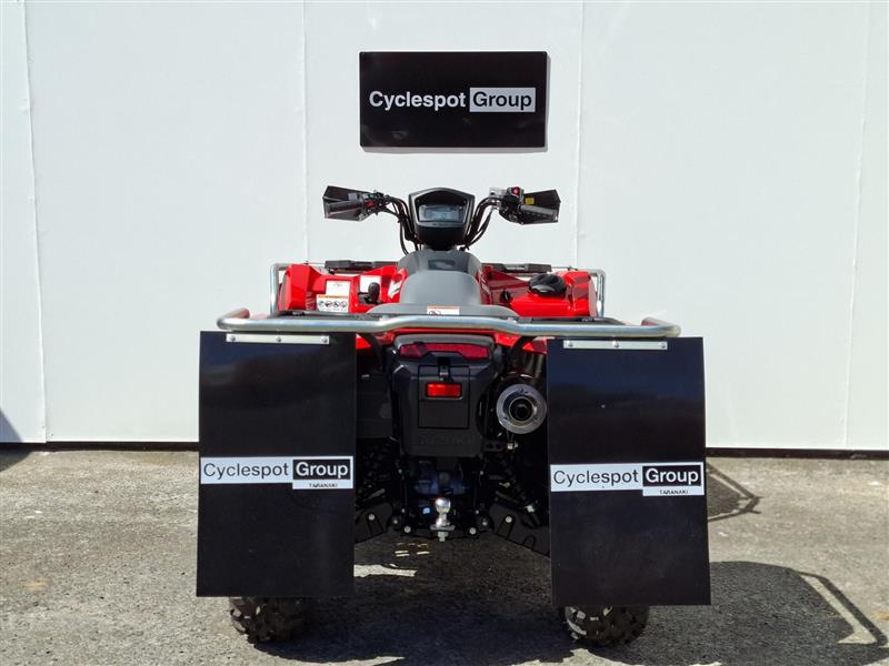 Load image into Gallery viewer, A red and black 2026 Suzuki KingQuad LT-A500 all-terrain vehicle (ATV) is photographed from the rear, positioned in front of a white wall with a 'Cyclespot Group' sign. The vehicle features large black mudguards with 'Cyclespot Group' logos and a visible rear license plate.