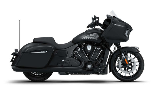 A black 2026 Indian Challenger Dark Horse motorcycle with saddlebags, a large windscreen, and an exposed V-twin engine, shown in profile against a white background.