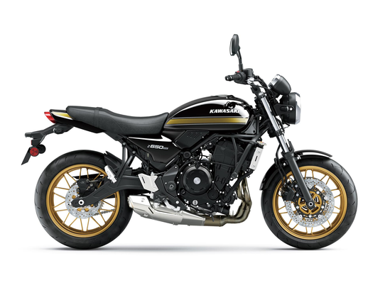 A black Kawasaki Z650R motorcycle with gold accents on the wheels, tank stripe, and engine details, shown from a side profile on a white background.