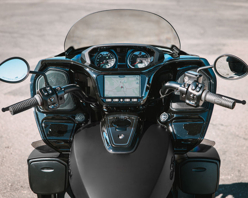 Load image into Gallery viewer, Close-up front view of a black 2026 Indian Roadmaster Limited motorcycle with a clear windshield, dual mirrors, instrument gauges, and a central digital display, photographed outdoors on a paved surface.
