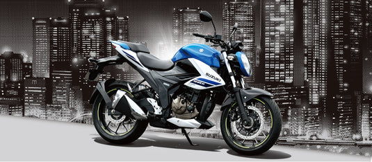 A blue and white 2025 Suzuki GSX 250 LAMS motorcycle positioned in front of a stylized black-and-white city skyline at night.